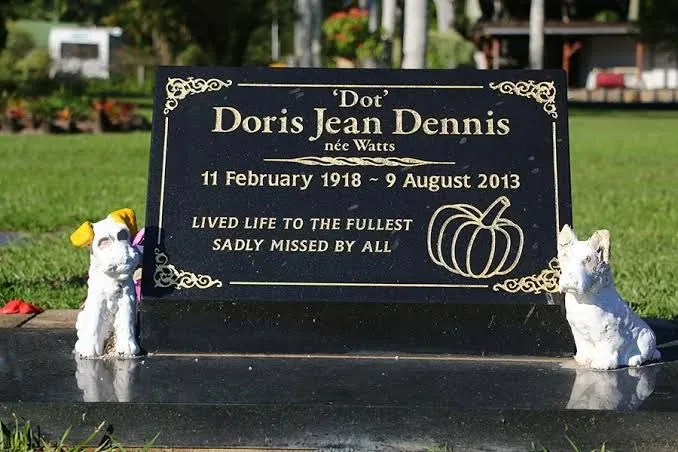 Black granite lawn plaque with gold engraving and personalised motif